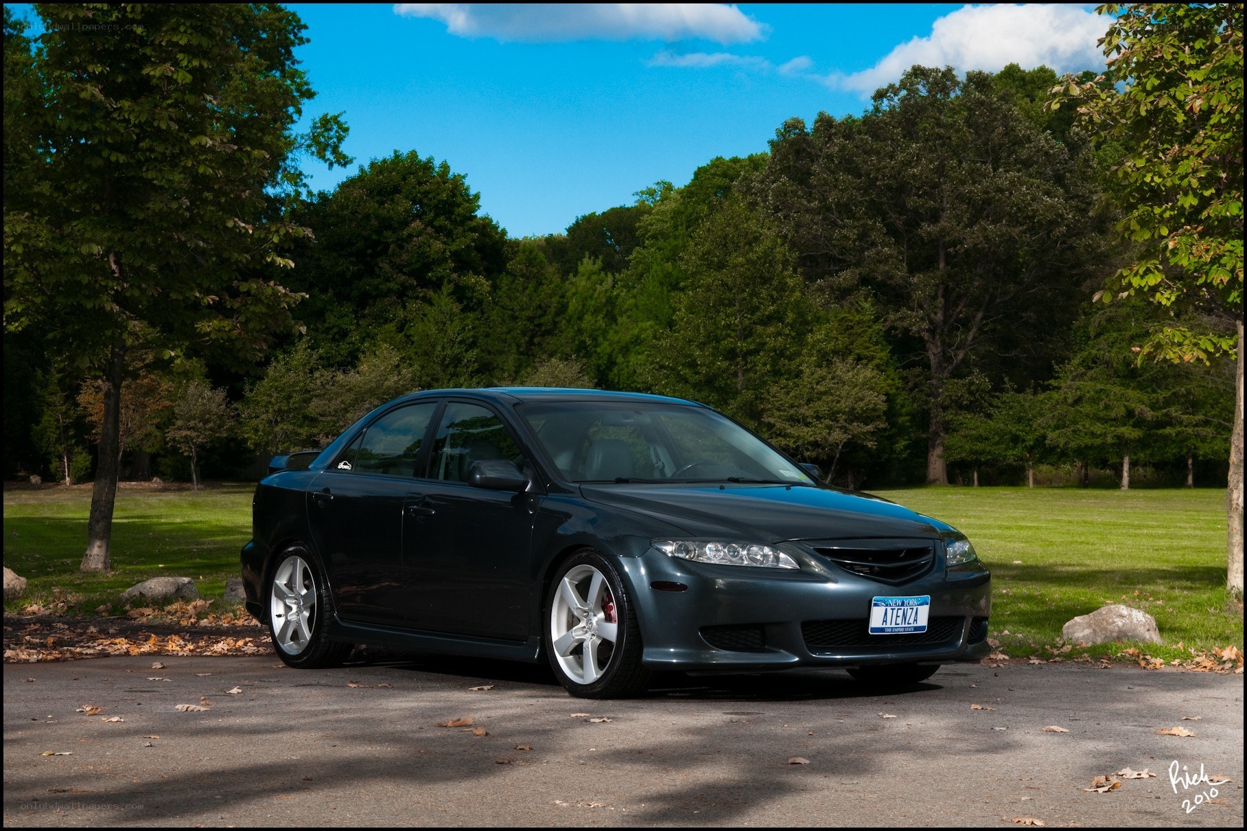 Dark sedan in a park
