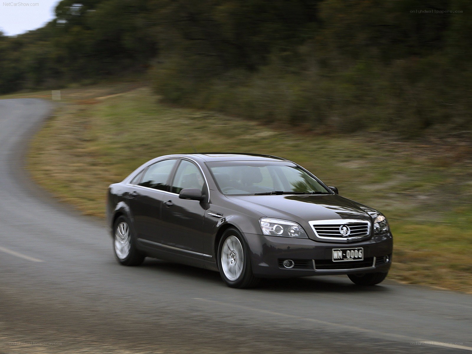 dark sedan on a winding road