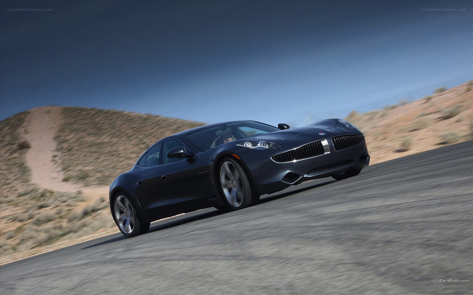 dark sedan on desert road