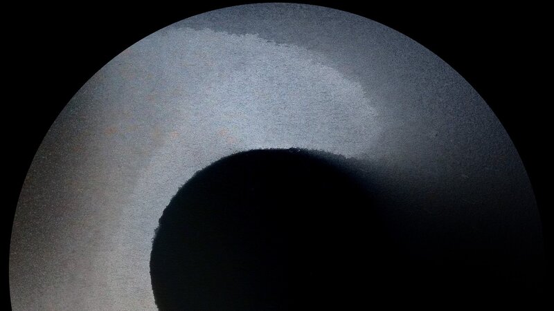 Dark Shape on Gray Surface
