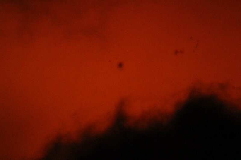 Dark Silhouette Against Red Sky