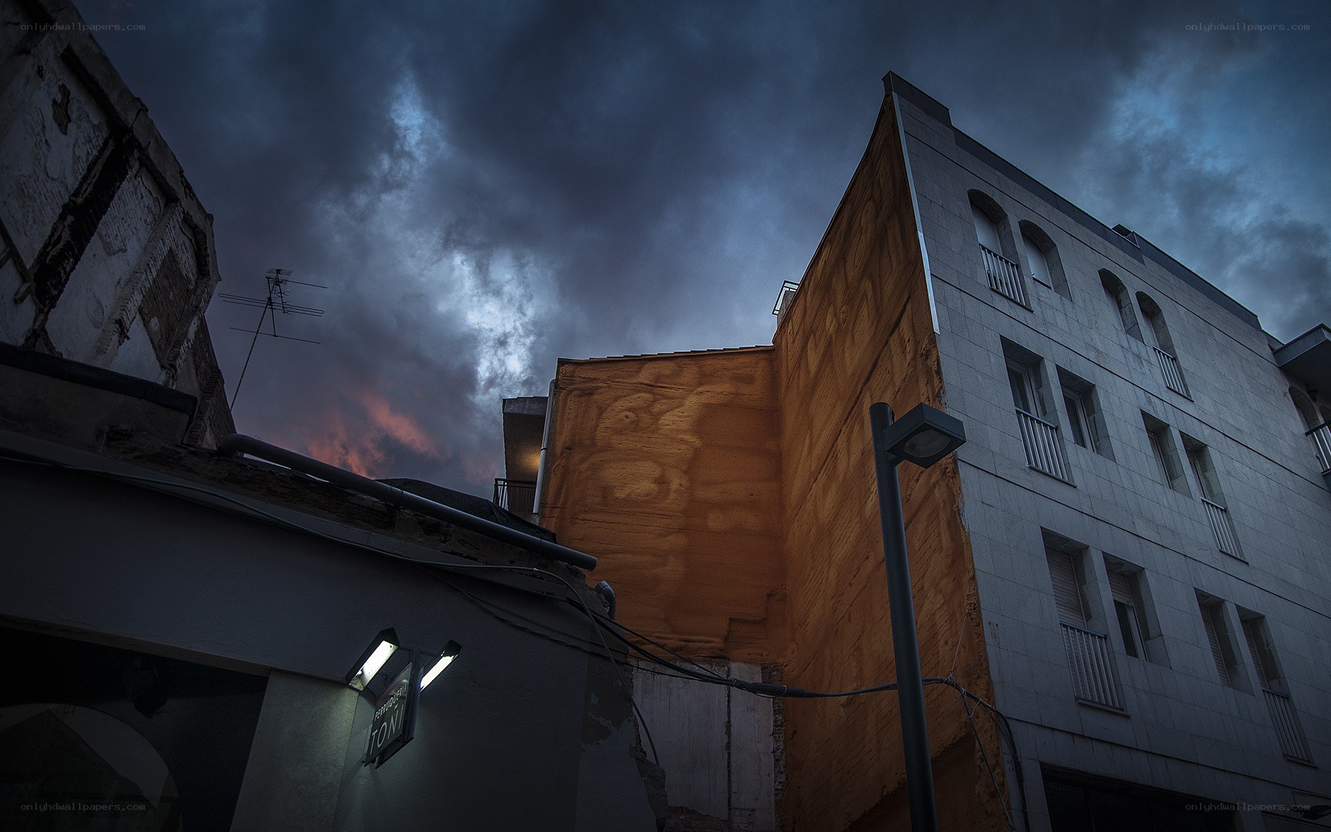 Dark sky over city buildings
