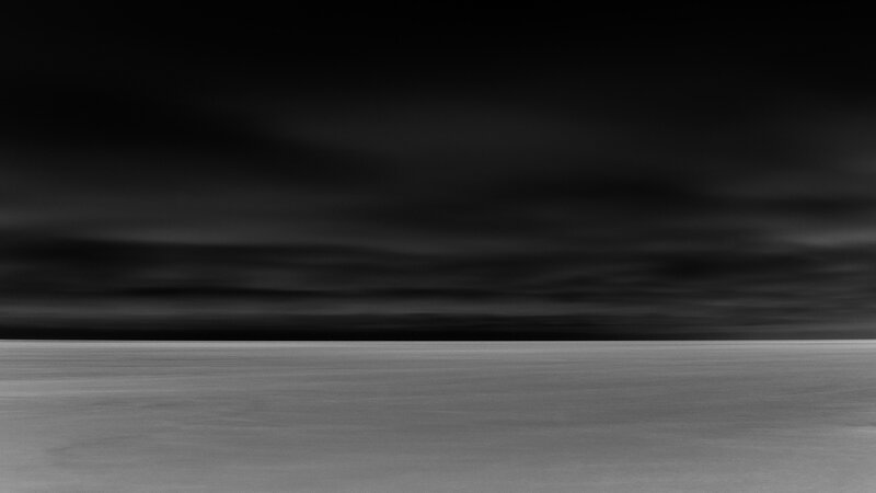 Dark sky over flat landscape