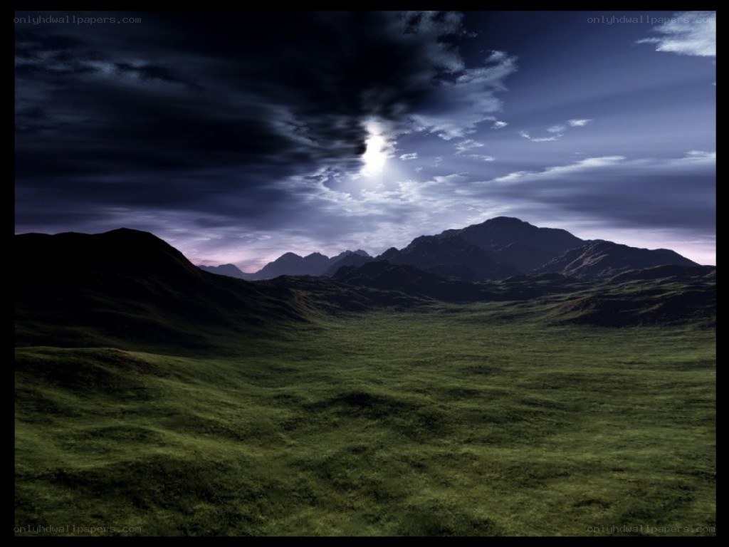 Dark sky over green hills