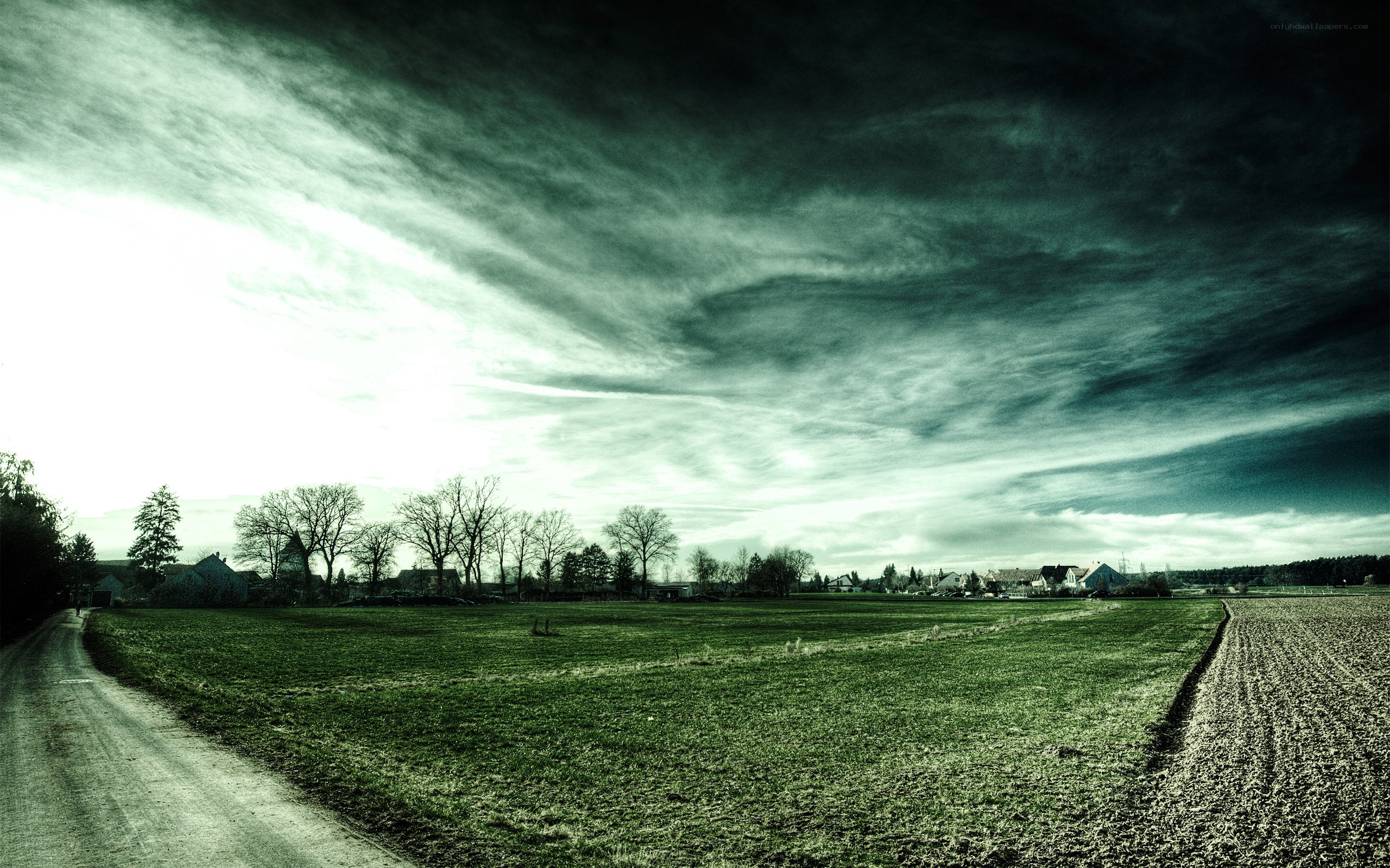 Dark sky over rural landscape