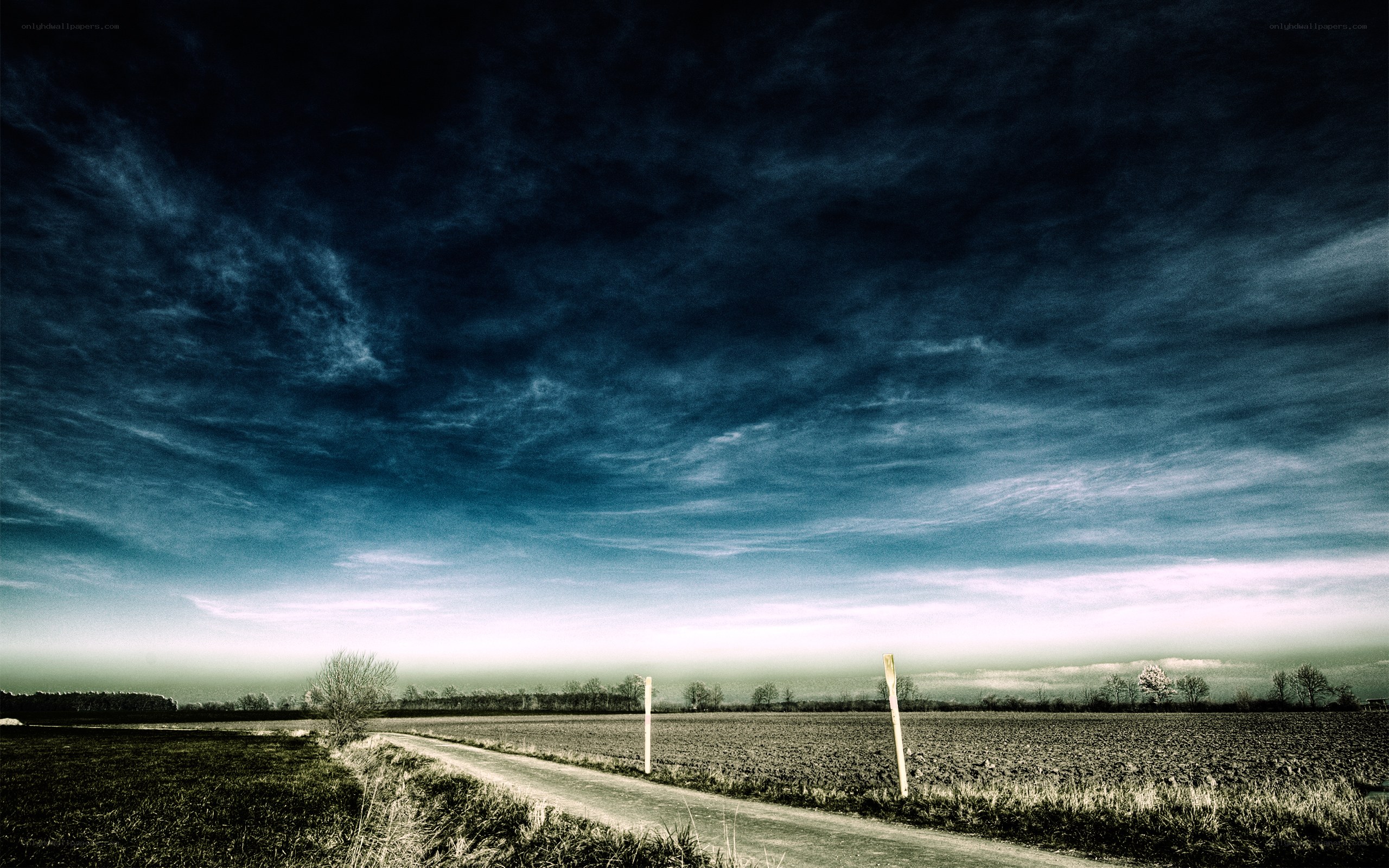 Dark sky over rural road