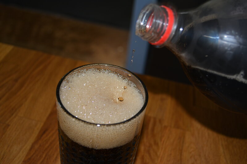 Dark Soda Being Poured