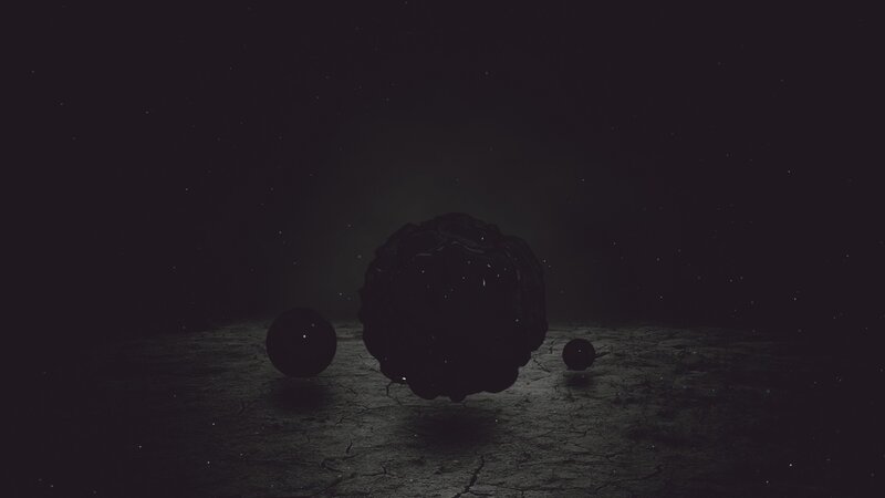 dark spheres on cracked ground