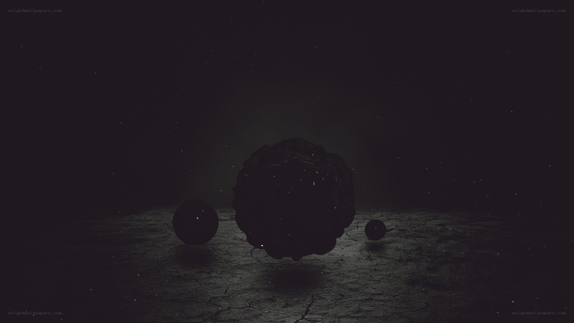 dark spheres on cracked ground