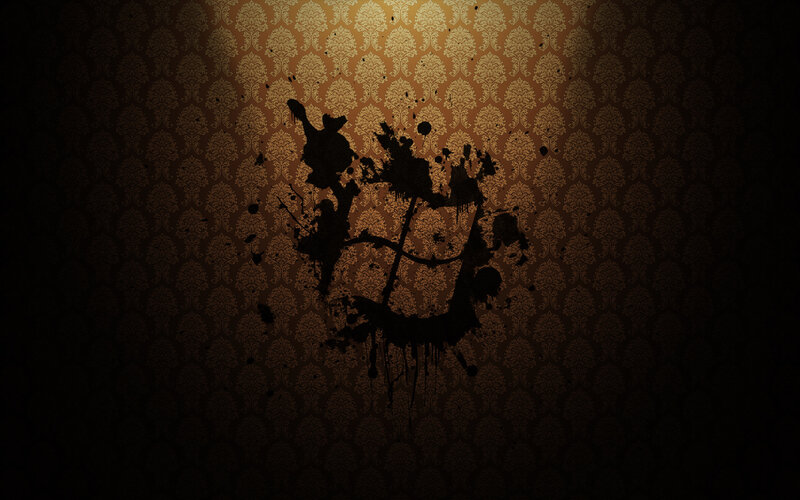dark splatter on patterned wall