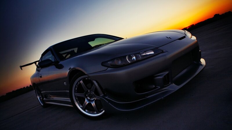dark sports car at sunset