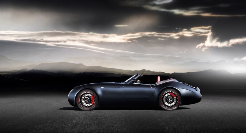 Dark sports car on a road