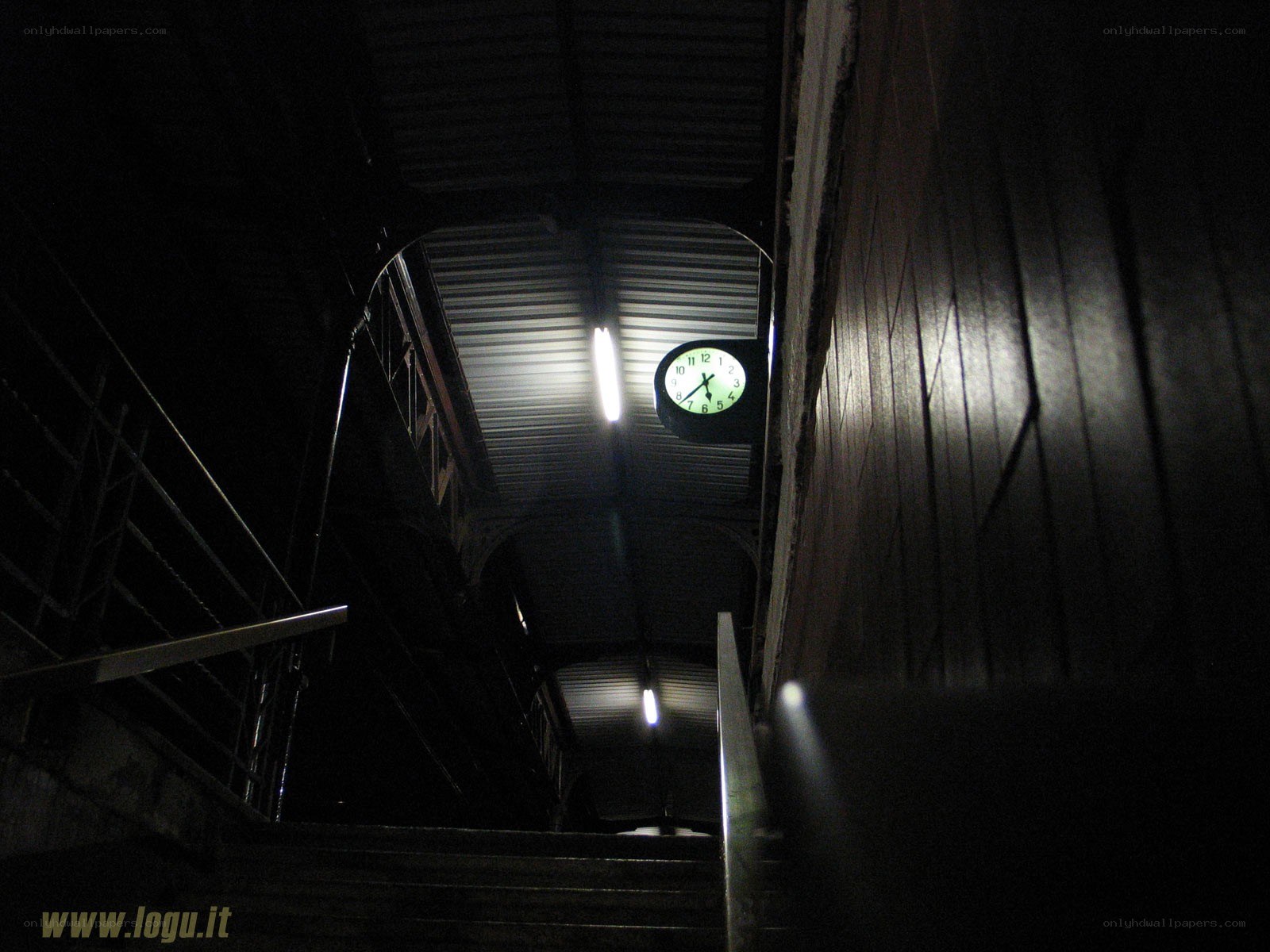Dark staircase with clock
