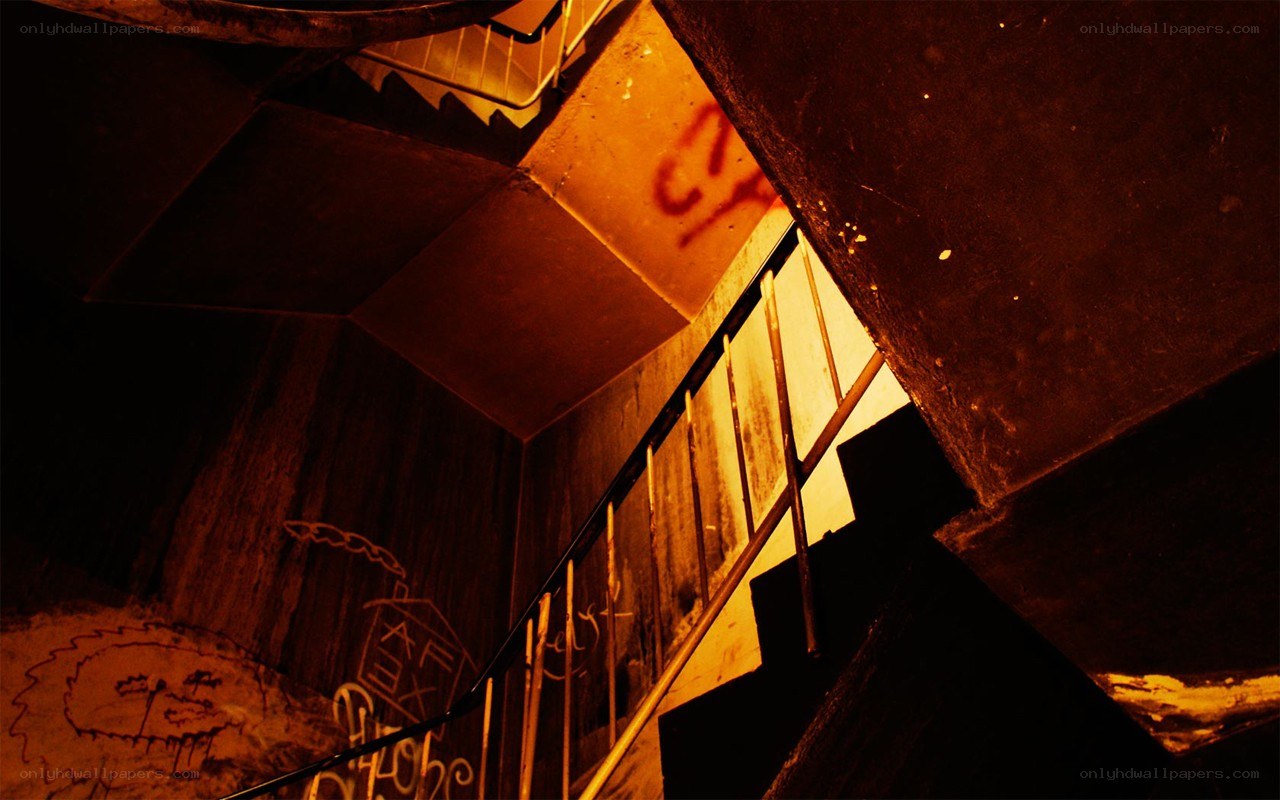 dark stairwell with graffiti