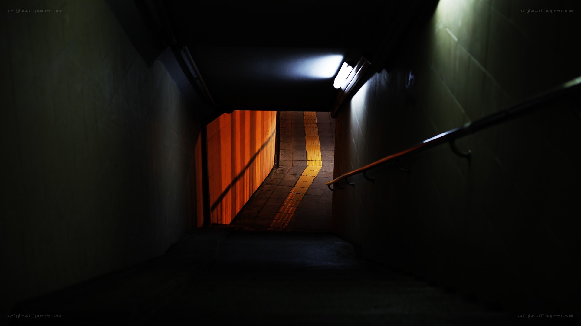 dark stairwell with light at end
