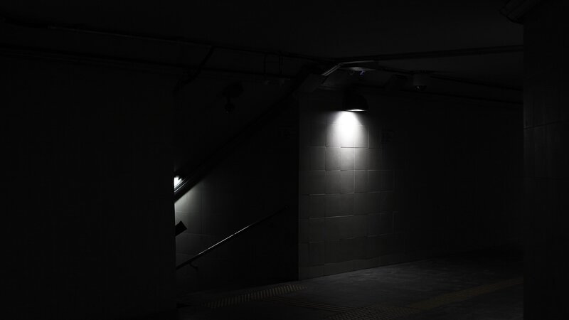 dark stairwell with single light
