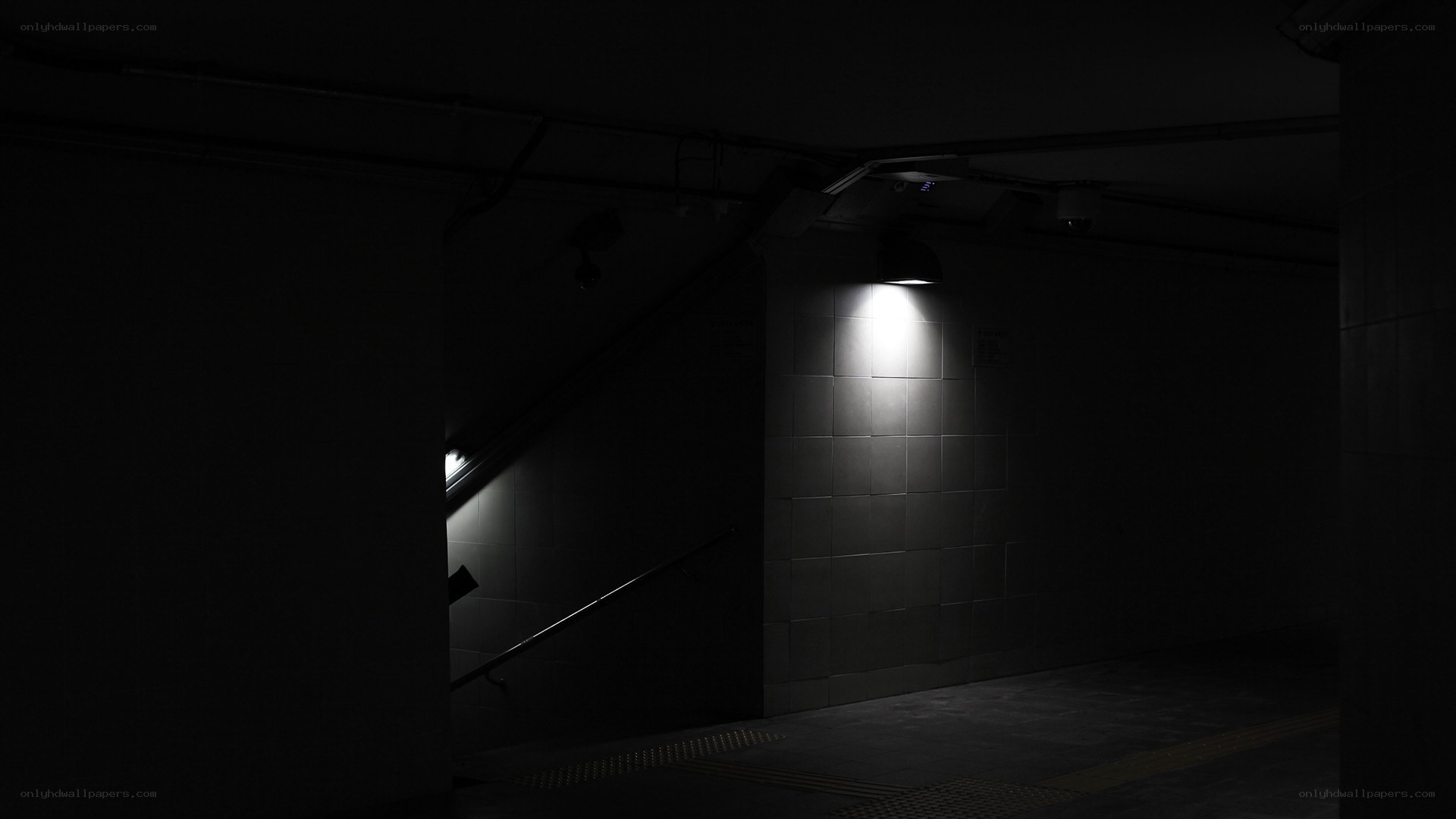dark stairwell with single light
