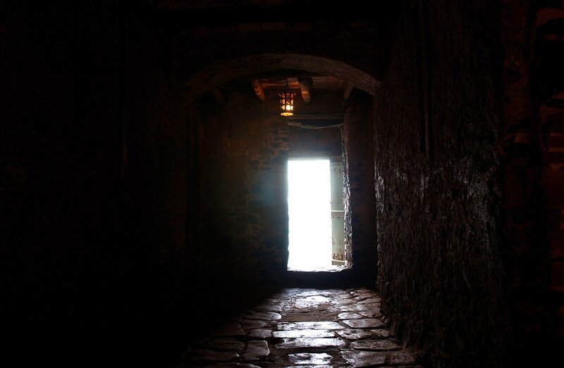 dark stone corridor with light