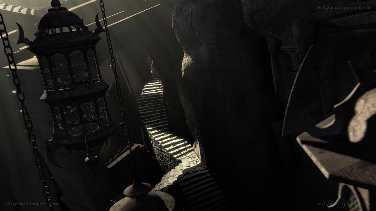 dark stone staircase with lantern