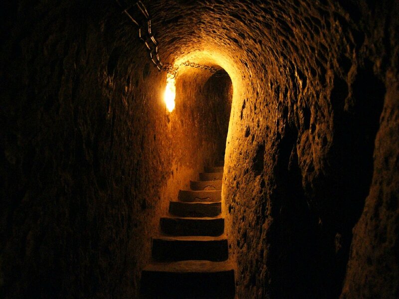 dark stone tunnel with stairs