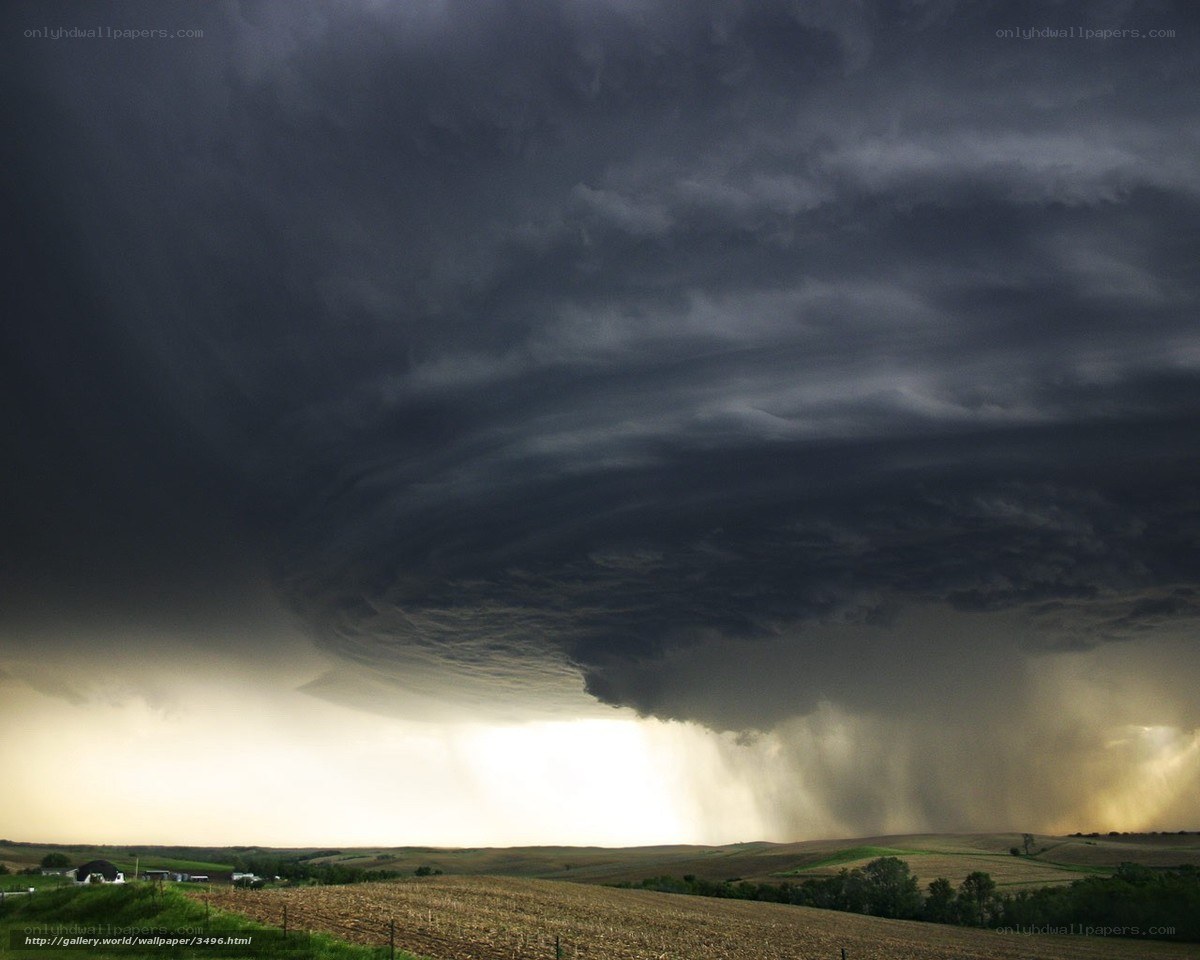 Dark storm cloud over farmland