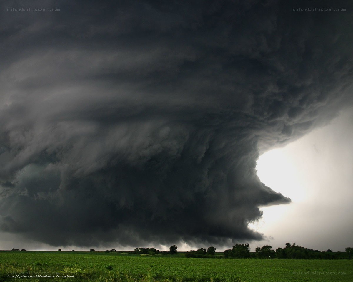 Dark storm cloud over field