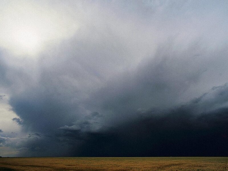 Dark storm clouds over a field