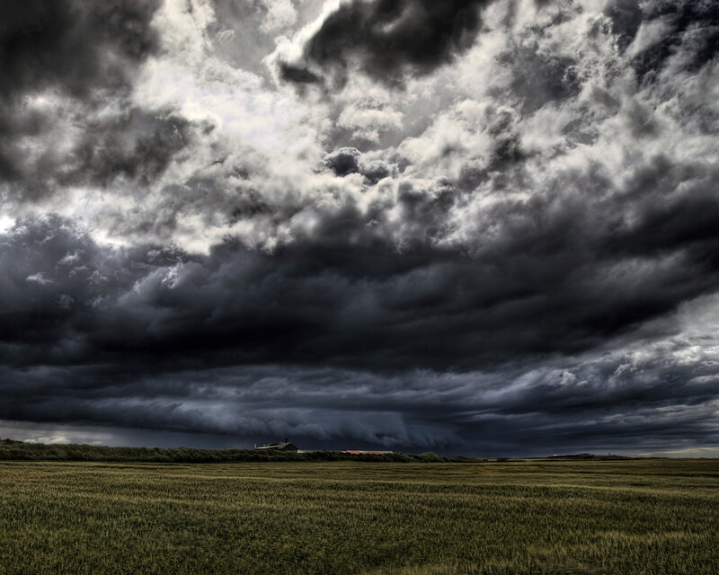 Dark storm clouds over a field