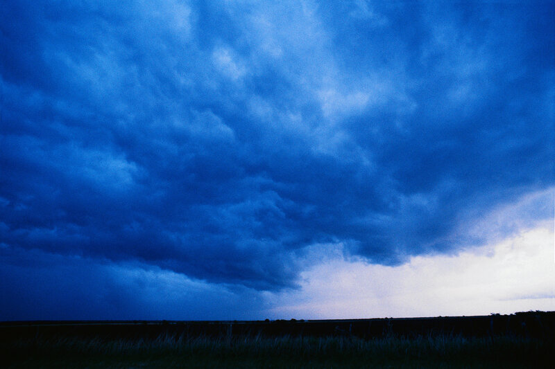 Dark storm clouds over a field