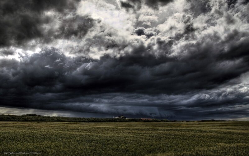 Dark storm clouds over a field
