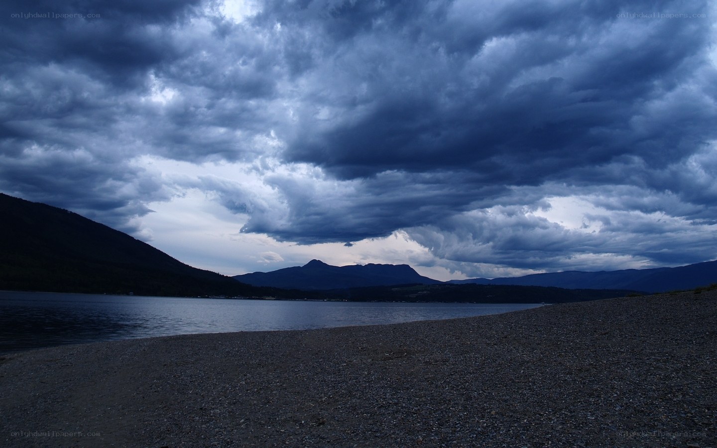 Dark storm clouds over a lake