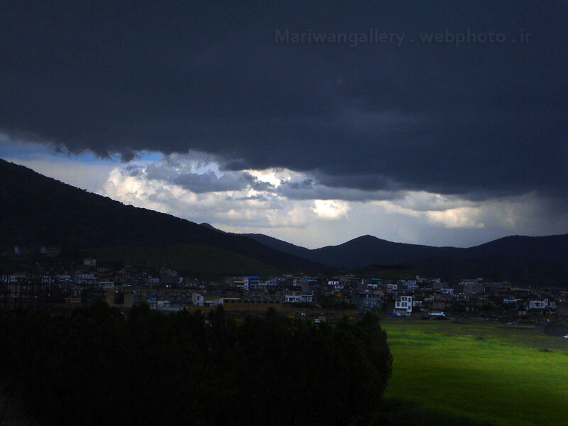 Dark storm clouds over a valley