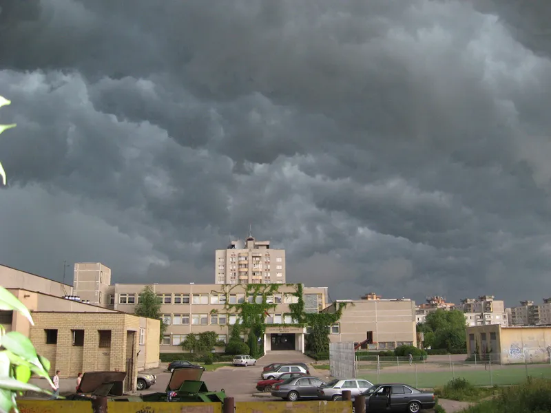 Dark storm clouds over buildings