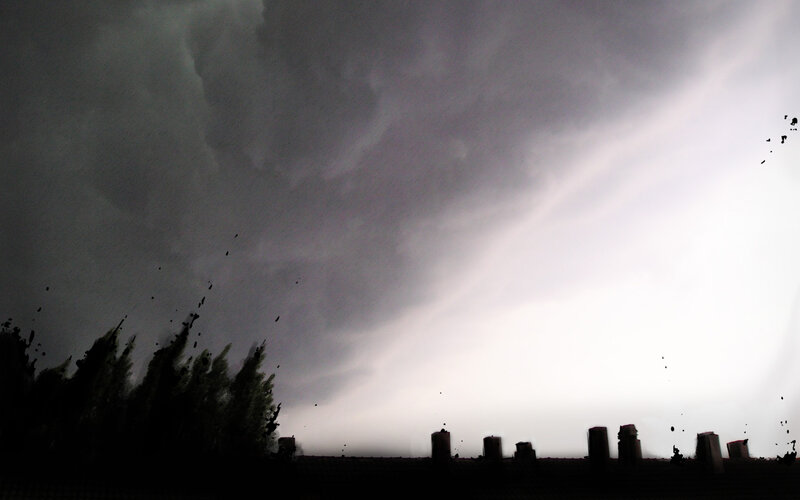 dark storm clouds over city