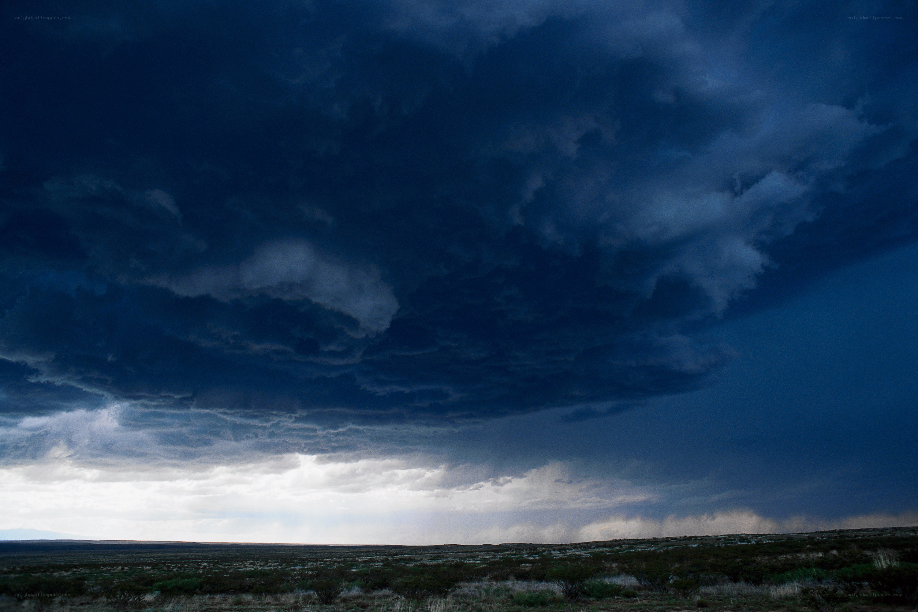 Dark storm clouds over desert