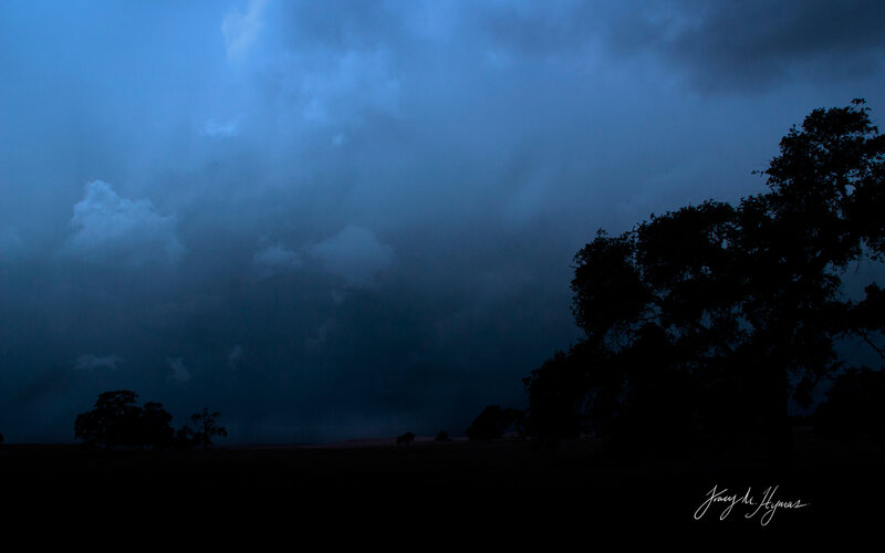 Dark Storm Clouds over Field — Blue