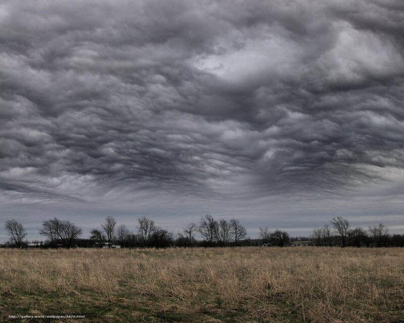 Dark storm clouds over field