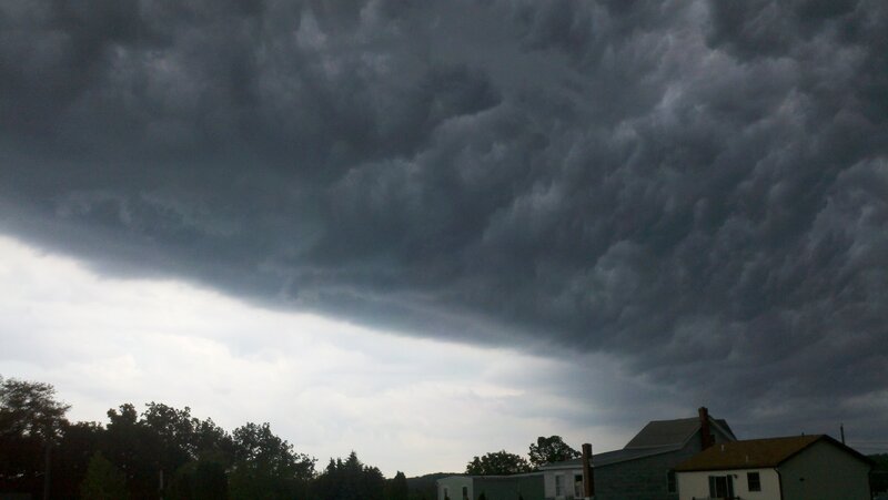 dark storm clouds over houses