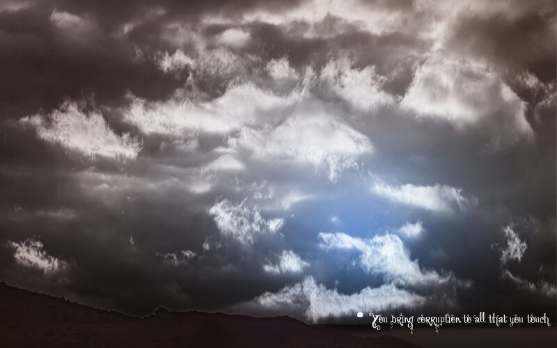 dark storm clouds over mountains