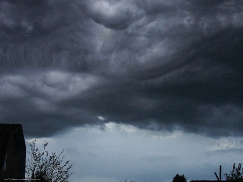 Dark storm clouds over rooftops