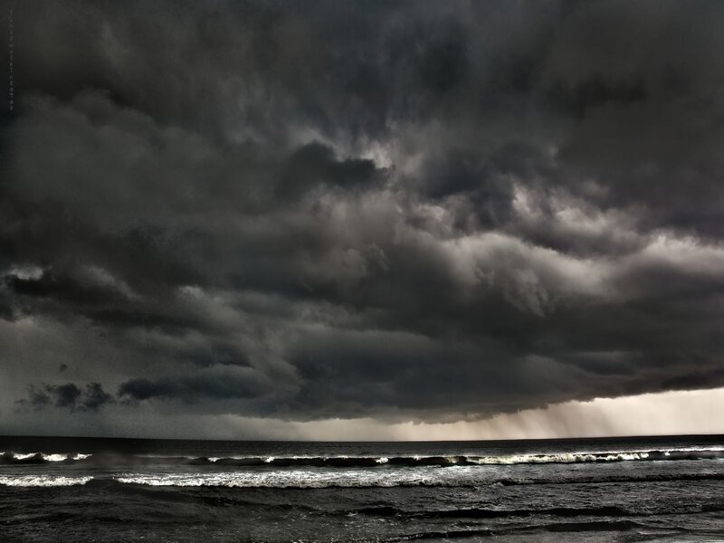 Dark storm clouds over the ocean