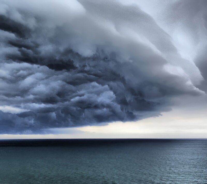 Dark storm clouds over the sea