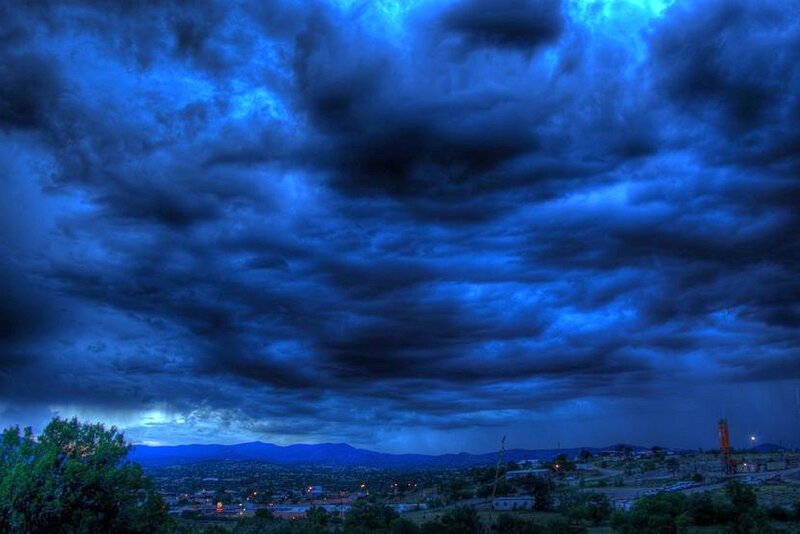 dark storm clouds over town