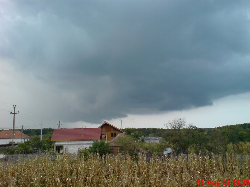 Dark storm clouds over village