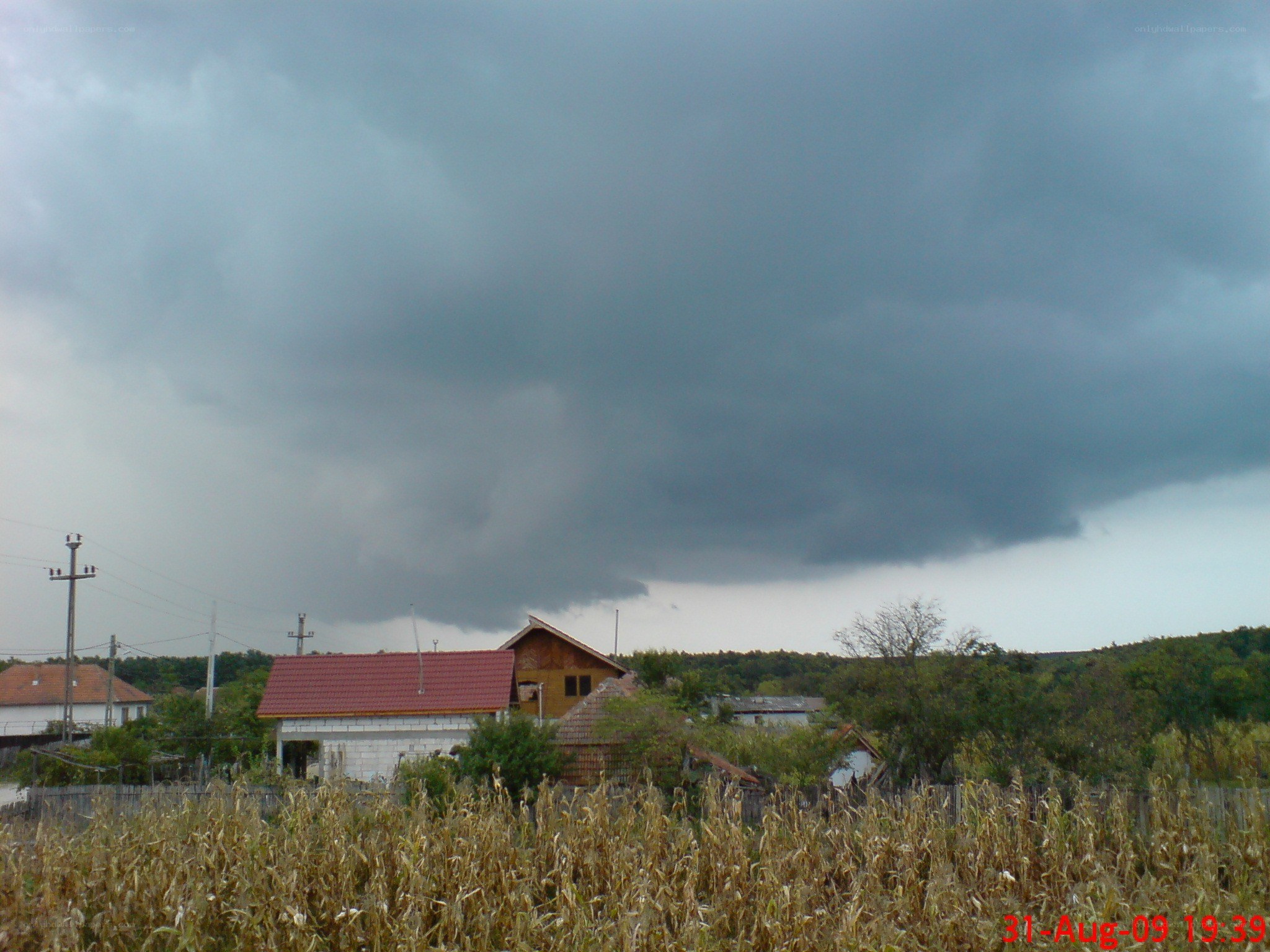 Dark storm clouds over village