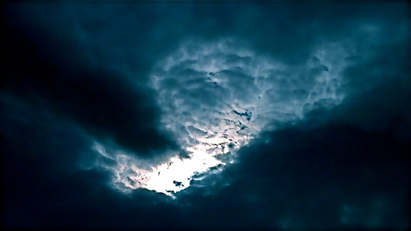 dark storm clouds with moonlight