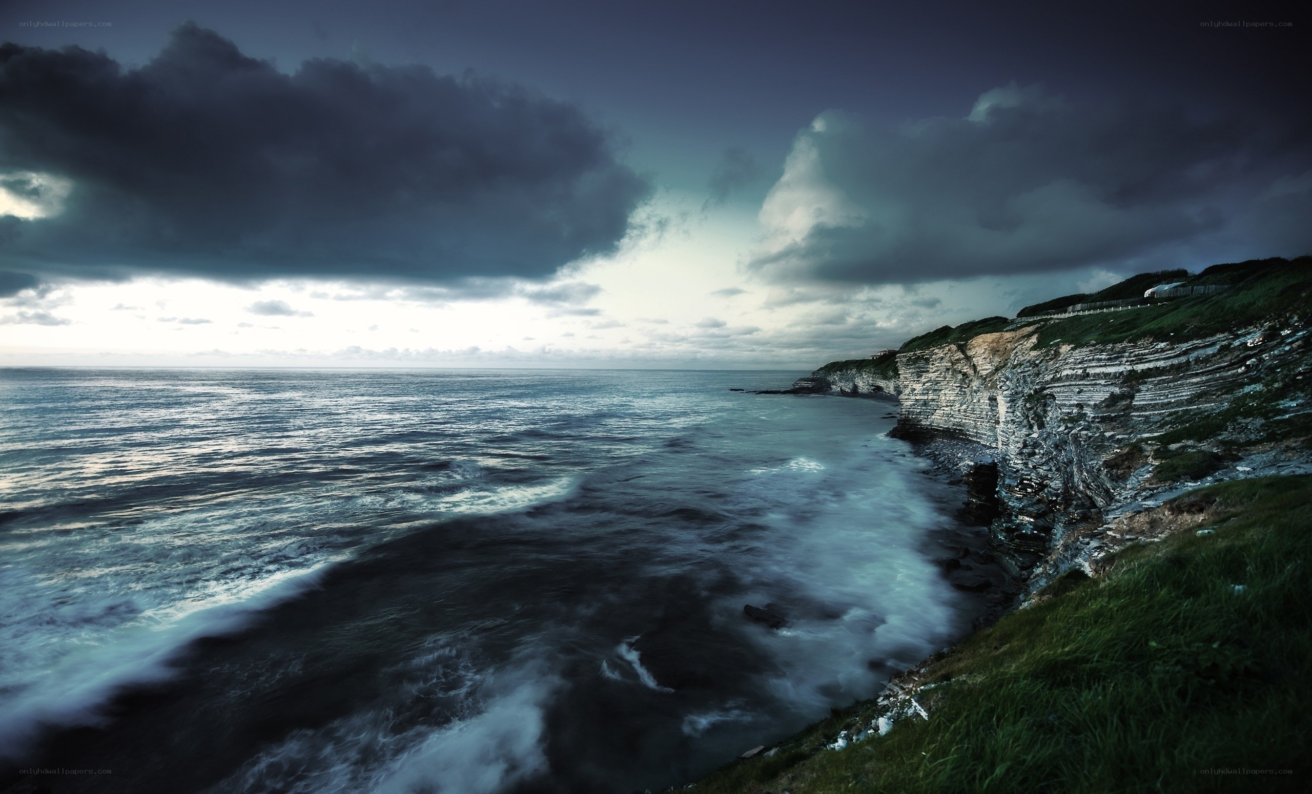 Dark storm over coastal cliffs
