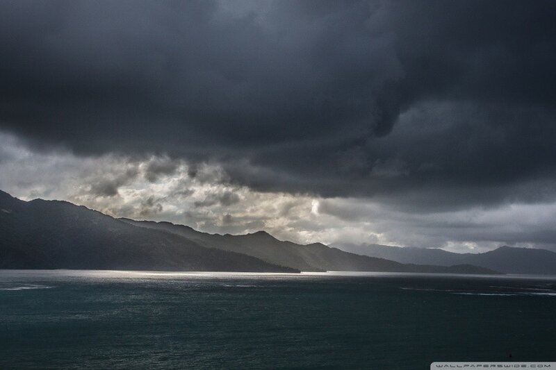 Dark storm over coastal mountains