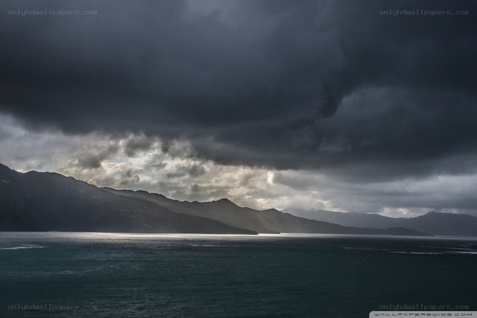 Dark storm over coastal mountains