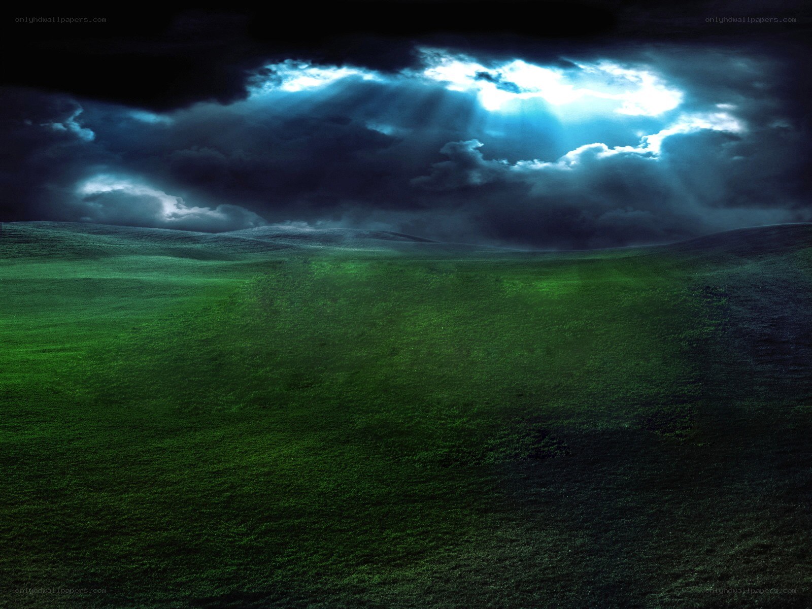 Dark storm over green hills